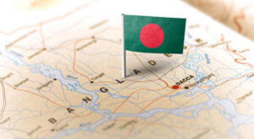 The flag of Bangladesh pinned on the map. Horizontal orientation. Macro photography.