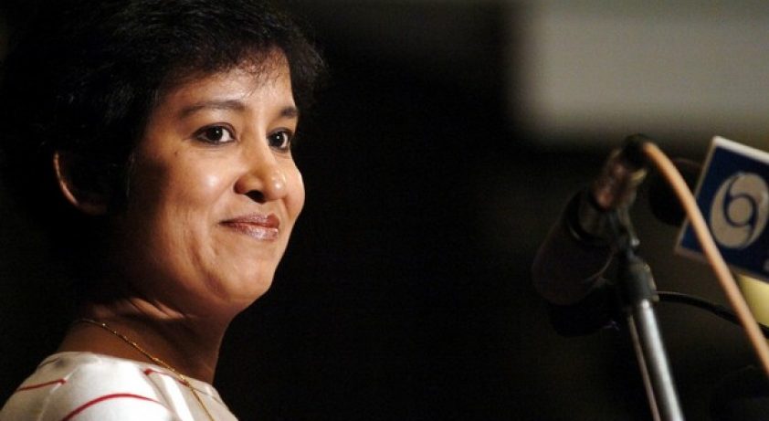 (FILES) In this picture taken 18 February 2004, Bangladeshi author Taslima Nasreen smiles while presenting the Hindi translation of her book "Andhakar" (Those Dark Days), the fourth part of her autobiography in New Delhi.  Security was stepped up for exiled Bangladeshi writer Taslima Nasreen, 18 August 2007, after a radical Muslim cleric issued a "death warrant" against the controversial author, police said.
   The move came after radical Muslim cleric Majidulla Khan Farhad accused Nasreen of "defaming" Islam and announced an "unlimited financial reward" to anybody who would kill her, according to the Press Trust of India. AFP PHOTO/Emmanuel DUNAND/FILES (Photo credit should read EMMANUEL DUNAND/AFP/Getty Images)